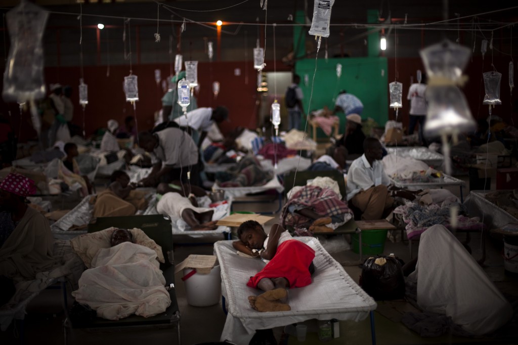 People suffering cholera symptoms are treated in a sports center converted into a cholera treatment center in Cap-Haitien, Haiti, in 2010.